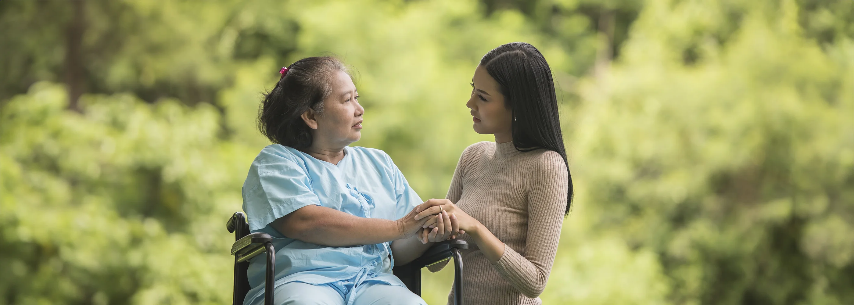 granddaughter-talking-with-her-grandmother-sitting-wheelchair-cheerful-concept-happy-family copy